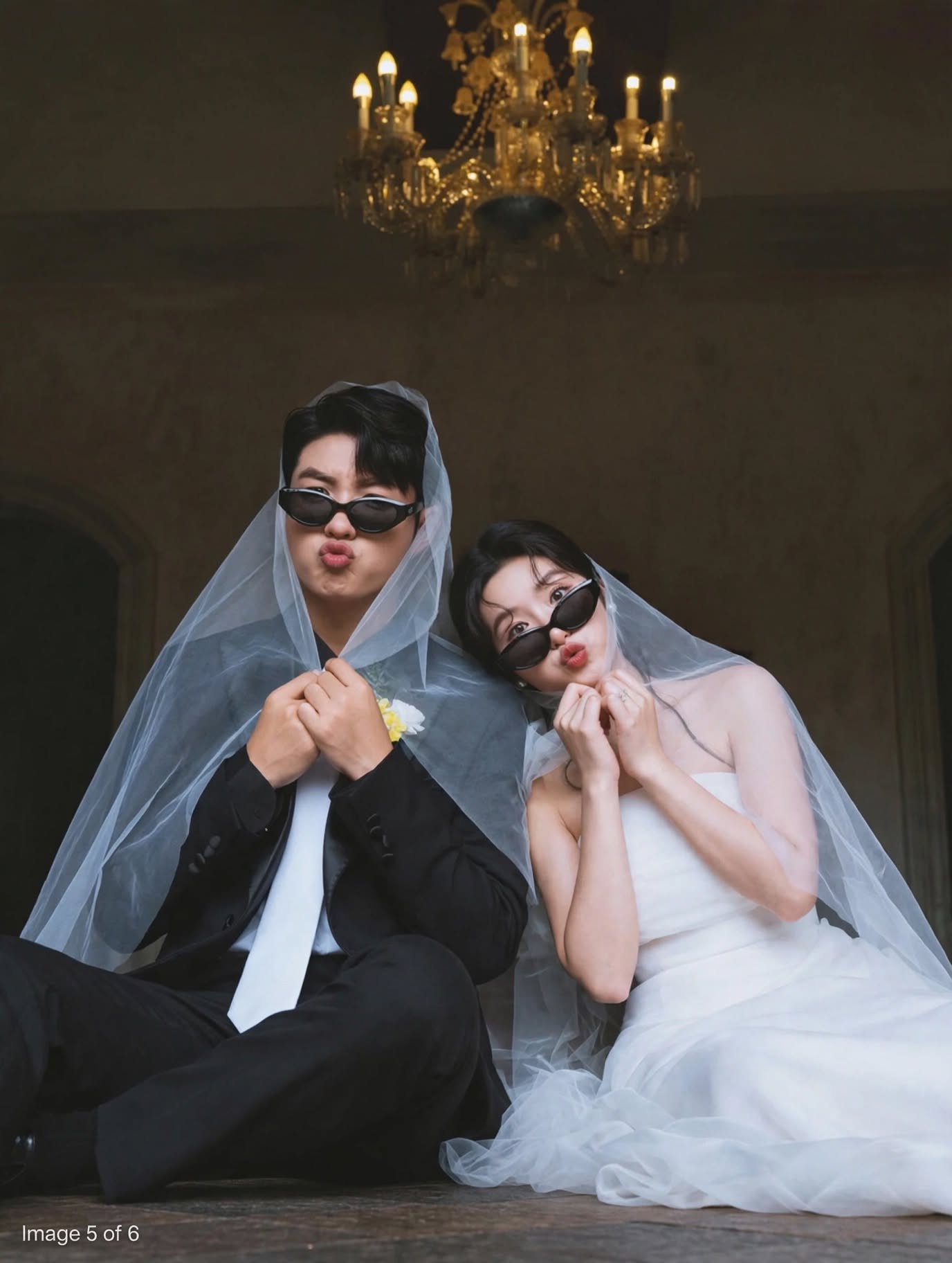 Funny Veil Wedding – Cute Couple in Sunglasses Under Chandelier